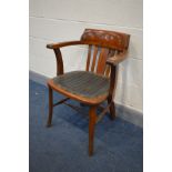 AN 1940'S OAK OFFICE ARMCHAIR