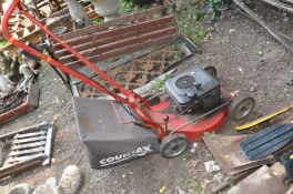 A COUNTAX PETROL LAWN MOWER with a Briggs and Stratton Quantum 35 engine ( in rusted condition ,