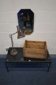 A BLACK METAL COFFEE TABLE, angle poise style desk lamp, wooden fruit crate and a canted bevel edged