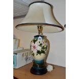 A MOORCROFT POTTERY TABLE LAMP IN THE HIBISCUS MOON PATTERN BY SIAN LEAPER, baluster shaped lamp