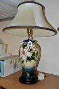 A MOORCROFT POTTERY TABLE LAMP IN THE HIBISCUS MOON PATTERN BY SIAN LEAPER, baluster shaped lamp