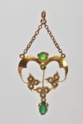 A YELLOW METAL EDWARDIAN PENDANT, of an openwork floral design, set with seed pearls and green