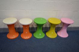 THREE TAM TAM CIRCULAR STOOLS, in three colours, along with a pair of similar stools stamped