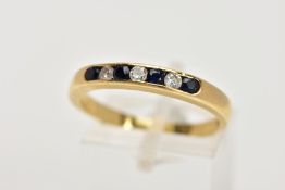 AN 18CT GOLD SAPPHIRE AND DIAMOND HALF ETERNITY RING, designed with a row of channel set circular