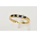 AN 18CT GOLD SAPPHIRE AND DIAMOND HALF ETERNITY RING, designed with a row of channel set circular