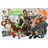 A BOX OF ASSORTED COSTUME JEWELLERY, to include various beaded necklaces, a white metal onyx