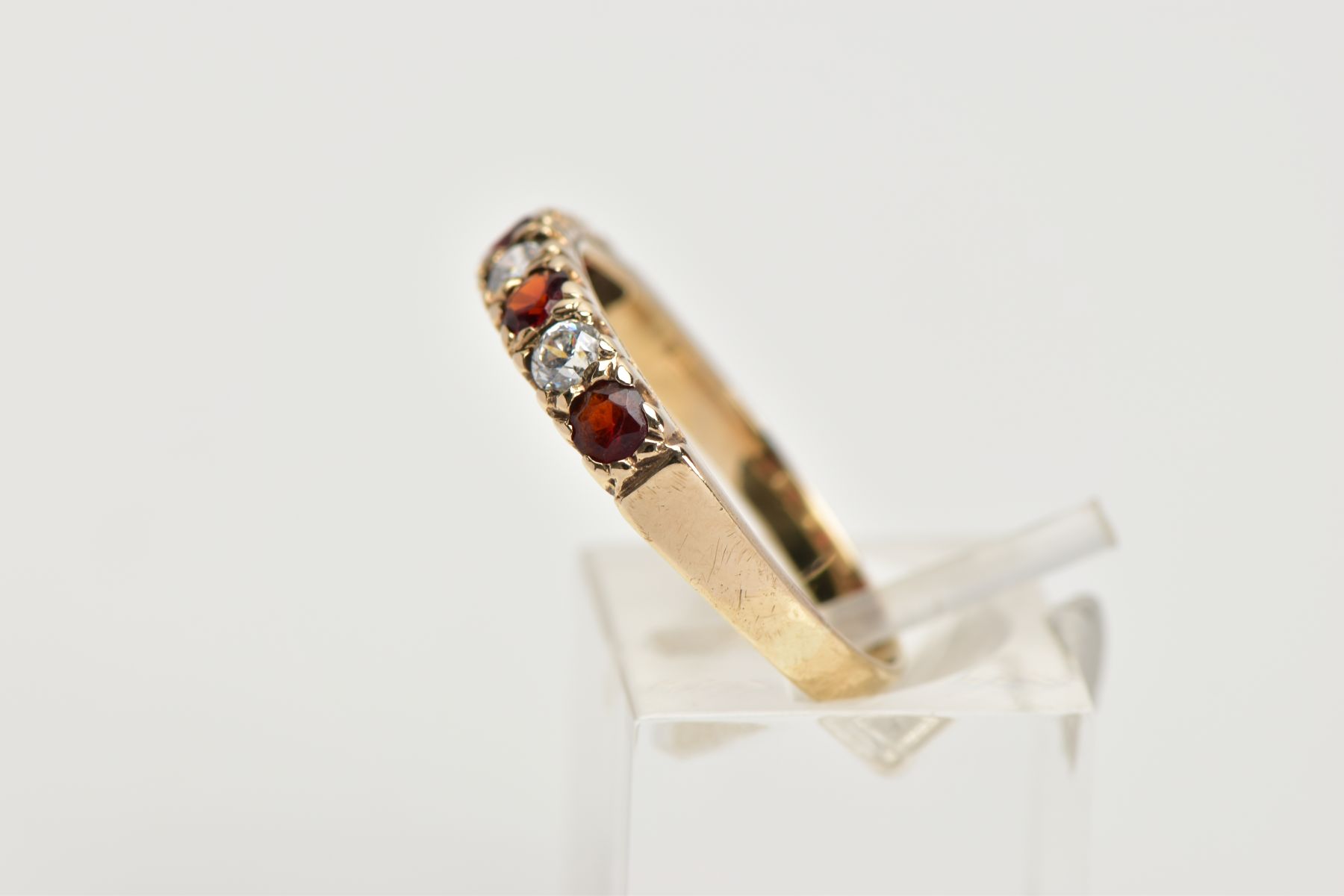A 9CT GOLD GARNET AND CUBIC ZIRCONIA HALF ETERNITY RING, designed with a row of four circular cut - Image 2 of 4