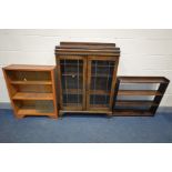 AN EARLY 20TH CENTURY OAK BOOKCASE, raised back, lead glazed effect doors enclosing two adjustable
