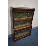 AN EARLY 20TH CENTURY OAK THREE SECTION BOOKCASE, lead glazed fall front doors and later internal