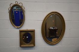 THREE VARIOUS GILT WOOD/PLASTER WALL MIRRORS, of various shapes and ages, largest mirror size 87cm x