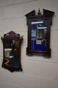 A GEORGIAN MAHOGANY FRETWORK WALL MIRROR, 42cm x 71cm along with an oak wall mirror with a