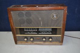 A VINTAGE MURPHY VALVE RADIO TYPE A242 RECEIVER in a Walnut case ( PAT pass, powers up but no