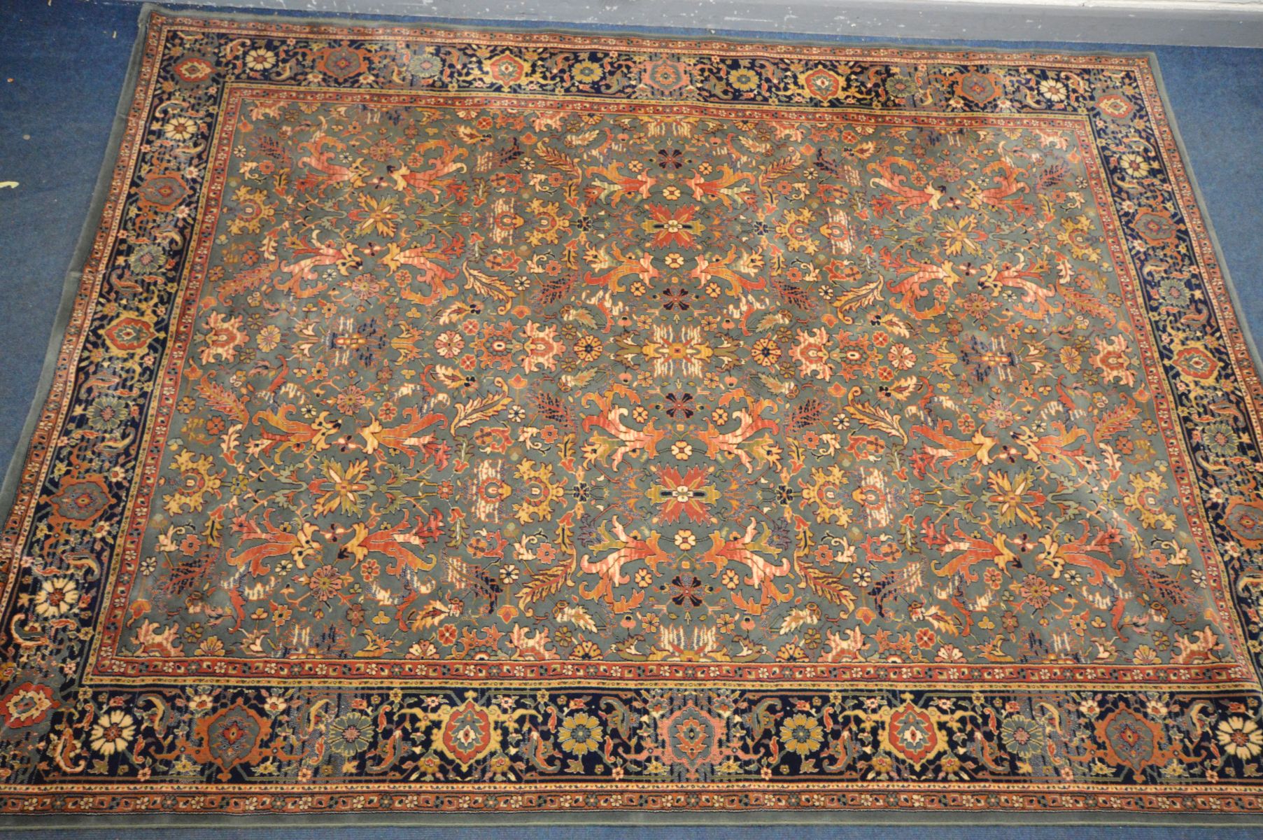 A LARGE WOOLLEN TABRIZ STYLE CARPET SQUARE, 346cm x 250cm and a pink tekke rug and a red rug (3)