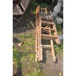 A SET OF WOODEN TRIPLE EXTENSION LADDERS 183cm long sections, and an earlier wooden step ladder (2)