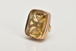 A VICTORIAN 9CT GOLD CITRINE FOB, of a rounded rectangular form set with a rectangular cut