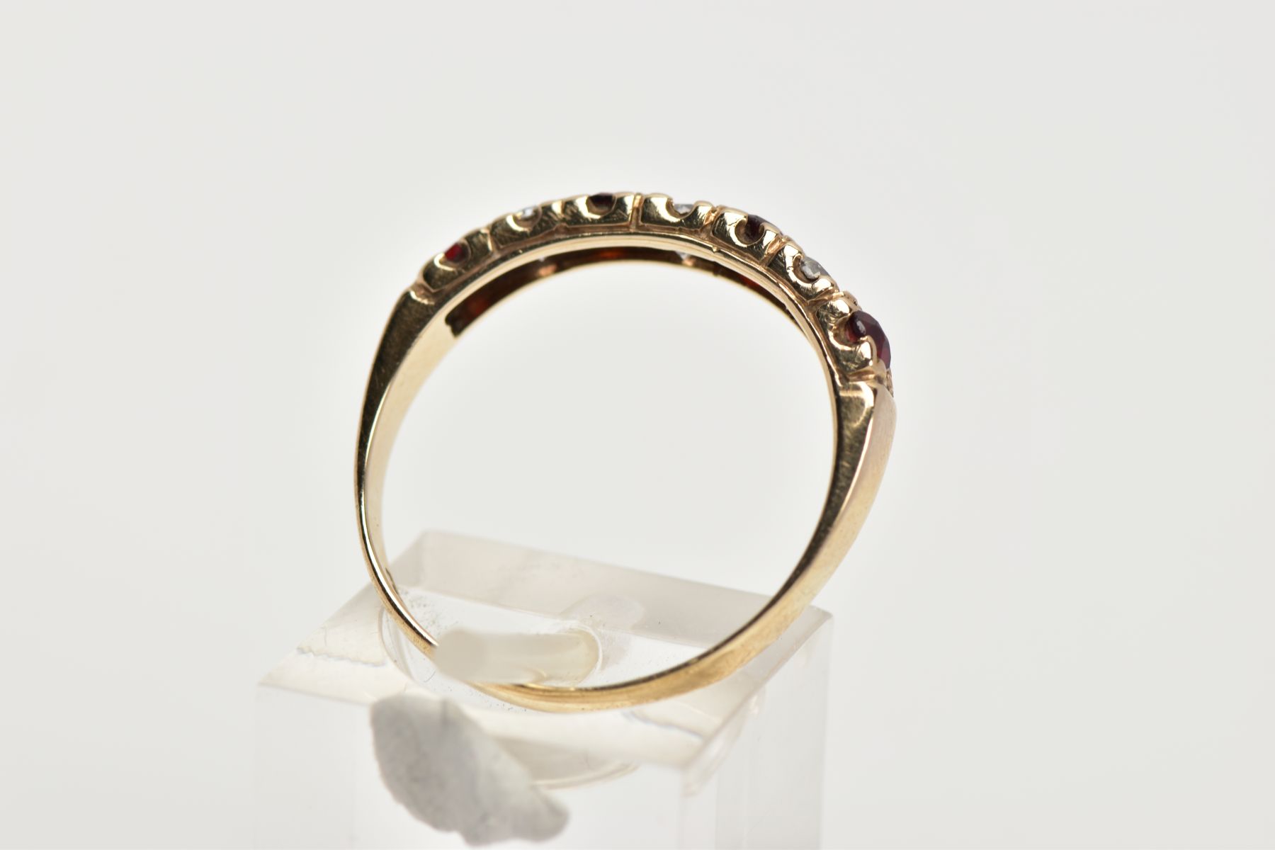 A 9CT GOLD GARNET AND CUBIC ZIRCONIA HALF ETERNITY RING, designed with a row of four circular cut - Image 3 of 4