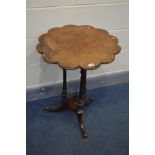 AN LATE VICTORIAN WALNUT TRIPOD TABLE, with a carved wavy top, triple supports and splayed legs,