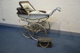 A VINTAGE MANTON PRAM/PERAMBULATOR, with carry case and attachable umbrella (condition - leather