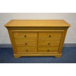 A SOLID OAK FRENCH STYLE SIDEBOARD/CHEST OF SIX DRAWERS, width 129cm x depth 46cm x height 90cm