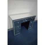 A CIMC HOME MIRRORED DRESSING TABLE, made up of seven assorted drawers, width 121cm x depth 45cm x