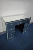 A CIMC HOME MIRRORED DRESSING TABLE, made up of seven assorted drawers, width 121cm x depth 45cm x