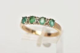 A 9CT GOLD EMERALD AND DIAMOND HALF ETERNITY RING, designed with a row of four claw set oval cut