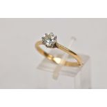 A DIAMOND SINGLE STONE RING, a modern round brilliant cut diamond claw set to knife edge shoulders