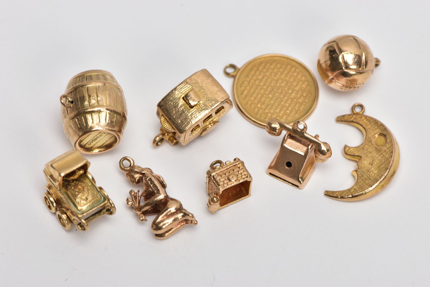 NINE 9CT GOLD CHARMS, to include a barrel, a hinged caravan, a pram and a telephone, all with 9ct - Image 3 of 3