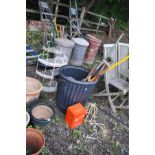 A PLASTIC DUSTBIN CONTAINING VARIOUS GARDEN TOOLS, a Veritas camping stove, three metal quadrant