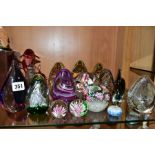 A GROUP OF SEVENTEEN MODERN GLASS PAPERWEIGHTS AND ORNAMENTS, mostly unbranded and of conical