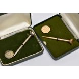 TWO CASED GOLF TEE AND MARKER SETS, the first in 9ct gold, 9ct hallmark for Birmingham 1977,