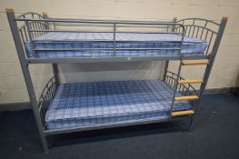 A METAL FRAMED BUNK BED with two mattresses