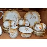 AN EARLY 20TH CENTURY M. REDON LIMOGES PORCELAIN TEA SET, blush ivory ground printed with floral