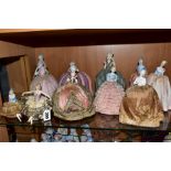 ELEVEN LATE 19TH/EARLY 20TH CENTURY PORCELAIN HALF-DOLL TEA COSIES, PIN CUSHIONS, HAT PINS CUSHIONS,