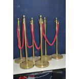 A SET OF SIX BRASS PEDESTAL ROPE BARRIERS with 4 ropes ( maybe brassed and brass)