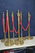 A SET OF SIX BRASS PEDESTAL ROPE BARRIERS with 4 ropes ( maybe brassed and brass)