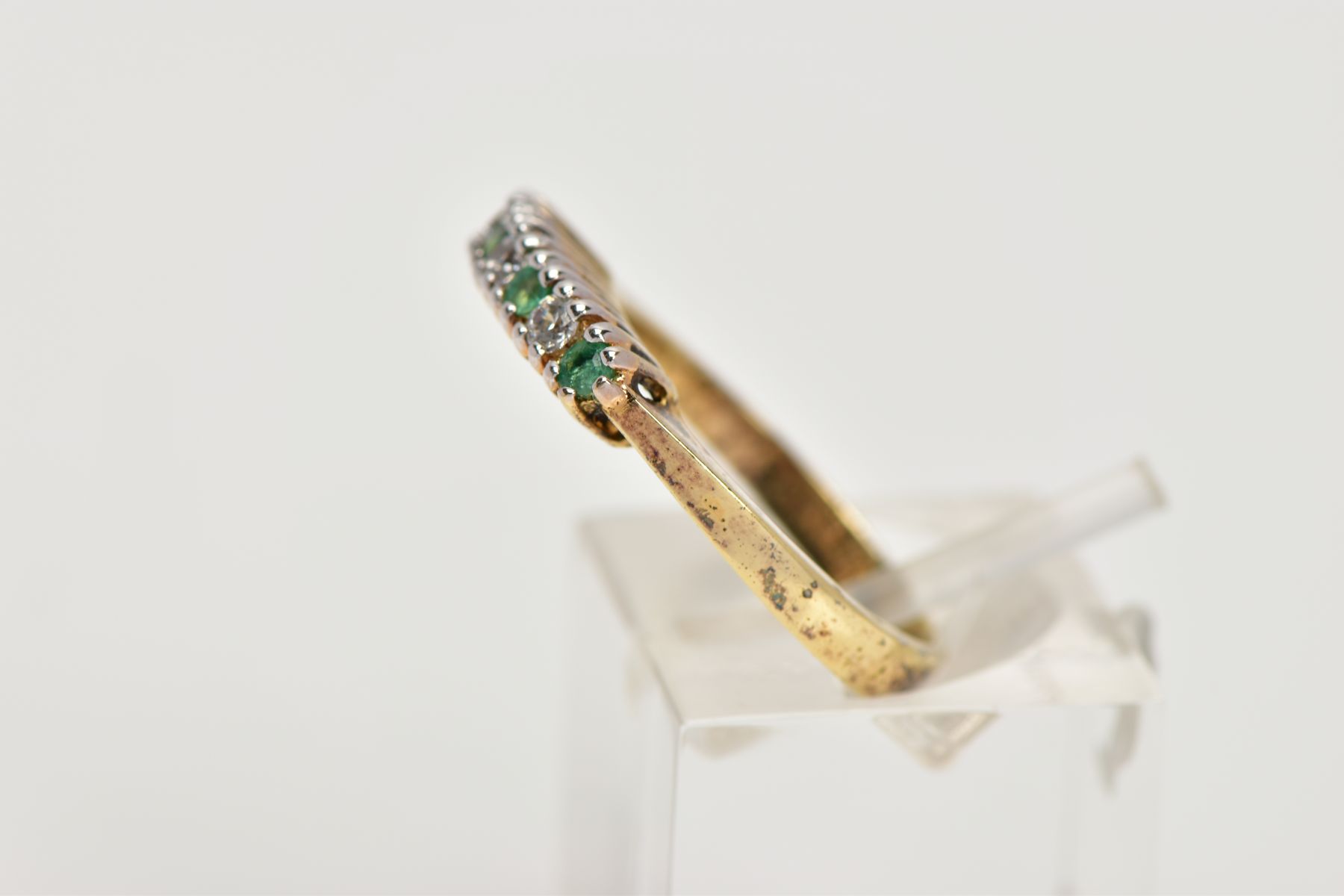 A GOLD-PLATED EMERALD AND CUBIC ZIRCONIA HALF ETERNITY RING, designed with a row of claw set, - Image 2 of 4