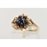 A 9CT GOLD SAPPHIRE CLUSTER DRESS RING, of a flower shape, set with seven circular cut blue