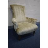 A CHAMPAGNE UPHOLSTERED ARMCHAIR, width 86cm