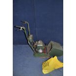 A VINTAGE ATCO PETROL CYLINDER MOWER with grass box and a bag containing spare parts( engine pull