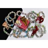 A BOX OF ASSORTED WHITE METAL CHARM BRACELETS AND BROOCHES, to include thirteen white metal charm