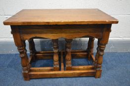 A REPRODUCTION GEORIGAN STYLE OAK COFFEE/NEST OF THREE TABLES