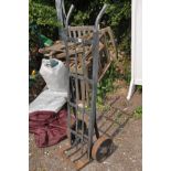 A VINTAGE METAL SACK TRUCK with cast iron wheels