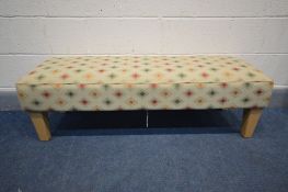 A LONG UPHOLSTERED FOOTSTOOL, length 125cm