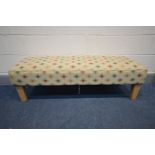 A LONG UPHOLSTERED FOOTSTOOL, length 125cm