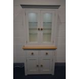 A PARTIALLY PAINTED AND OAK DISPLAY CABINET, with double glazed doors, led lighting, and two
