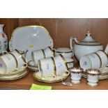 A COALPORT 'ELITE-GOLD' PATTERN TEA SET, comprising tea pot (second), milk jug, twin handled sugar