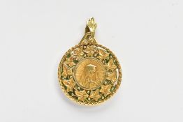 A YELLOW METAL PENDANT, of a circular form depicting the virgin Mary within a surround of vine