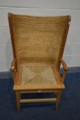 A LATE 20TH CENTURY BEECH ORKNEY CHAIR, woven wicker back and drop in seat pad, width inner width