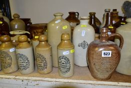 A QUANTITY OF STONEWARE BOTTLES, FLAGONS, JARS, etc, hot water bottles, salt pot with wooden